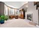 Relaxing sitting area with fireplace and built-in cabinetry at 29432 Camelback Ln, Evergreen, CO 80439