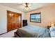 Comfortable bedroom featuring a view from the window and closet doors with nice wood grain at 1310 Spinnaker Trl, Monument, CO 80132