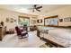 Spacious bedroom featuring a cozy reading corner, lots of decorations, and bright natural light at 1310 Spinnaker Trl, Monument, CO 80132