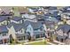Aerial view of the neighborhood showcasing homes, well-maintained lawns, and proximity to amenities at 9768 E 62Nd Dr, Denver, CO 80238