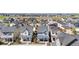 Aerial view of neighborhood homes with green lawns, trees, and sidewalks, showcasing a well-planned community at 9768 E 62Nd Dr, Denver, CO 80238