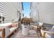 Inviting backyard patio with stylish seating, fire pit, and cozy rug for relaxation and entertainment at 9768 E 62Nd Dr, Denver, CO 80238