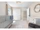 Charming bedroom featuring modern light fixture, a dresser, closet, and a crib, and views to the hallway at 9768 E 62Nd Dr, Denver, CO 80238