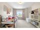 Comfortable bedroom featuring decor, plush carpet, a metal frame bed, a large window, and storage shelves at 9768 E 62Nd Dr, Denver, CO 80238