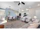 Open-concept living space with dining area, kitchen, and comfortable seating at 9768 E 62Nd Dr, Denver, CO 80238