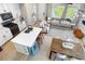 Open-concept living space with kitchen island, dining area, and view of the living room at 9768 E 62Nd Dr, Denver, CO 80238