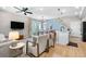 Well-lit living space showcasing kitchen, dining area, and comfortable seating arrangement at 9768 E 62Nd Dr, Denver, CO 80238