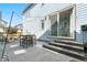 Charming patio with table, chairs, and string lights, perfect for outdoor gatherings and relaxation at 9768 E 62Nd Dr, Denver, CO 80238
