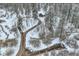 Wooded lot featuring a private circular driveway leading to a cozy cabin at 30570 Highway 72, Golden, CO 80403