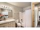 Well-lit bathroom with shower and tub combination and spacious vanity at 30570 Highway 72, Golden, CO 80403