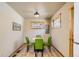 Cozy dining area with wood-trimmed windows and green chairs at 30570 Highway 72, Golden, CO 80403