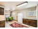 Eat-in kitchen with bright cabinets and floors at 30570 Highway 72, Golden, CO 80403