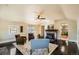 Cozy living room with a brick fireplace and polished dark wood floors at 30570 Highway 72, Golden, CO 80403