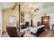 This cozy living room features hardwood floors, a ceiling fan, and natural light at 30570 Highway 72, Golden, CO 80403