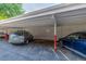 Community carport with assigned parking spaces at 1245 Columbine St # 306, Denver, CO 80206