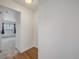 Hallway with hardwood floors leading to carpeted bedroom space at 1245 Columbine St # 306, Denver, CO 80206