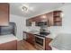 Modern kitchen with stainless steel appliances and ample cabinet space at 1245 Columbine St # 306, Denver, CO 80206