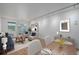 Bright living room featuring hardwood floors, a dining area, and modern furnishings at 1245 Columbine St # 306, Denver, CO 80206