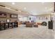 Finished basement featuring a seating area, custom shelving and sports decor at 16342 Parkside Dr, Parker, CO 80134