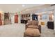 Spacious finished basement with seating area, sports memorabilia, and neutral carpeting at 16342 Parkside Dr, Parker, CO 80134