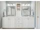 Bright bathroom with double vanity, contemporary mirrors, and stylish lighting fixtures at 16342 Parkside Dr, Parker, CO 80134