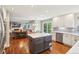 Spacious kitchen with an island and stainless steel appliances, open to the dining and living areas at 16342 Parkside Dr, Parker, CO 80134