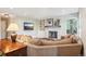 Comfortable living room featuring a stone fireplace, built-in shelves, and a large sectional sofa at 16342 Parkside Dr, Parker, CO 80134