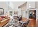 Inviting living room featuring hardwood floors, a neutral color palette, and an adjacent office space at 16342 Parkside Dr, Parker, CO 80134