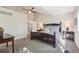 Spacious main bedroom with high ceilings, neutral colors and a king-sized bed at 16342 Parkside Dr, Parker, CO 80134