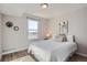 Bedroom featuring hardwood floors, natural light, and modern fixtures at 499 Wright St # 308, Lakewood, CO 80228