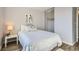 Bedroom features a spacious closet, hardwood floors, and modern fixtures at 499 Wright St # 308, Lakewood, CO 80228