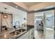 Open-concept kitchen featuring granite countertops and an eat-in bar, connecting to living spaces at 499 Wright St # 308, Lakewood, CO 80228