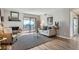 Cozy living room features a fireplace, balcony access, and neutral decor at 499 Wright St # 308, Lakewood, CO 80228