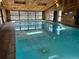Indoor pool with a wood ceiling and large windows at 499 Wright St # 308, Lakewood, CO 80228