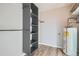 A utility room with wood floors and large shelving for plenty of storage at 499 Wright St # 308, Lakewood, CO 80228