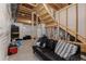 Spacious unfinished basement with access to the upper level and open layout at 8550 Cheraw St, Littleton, CO 80125