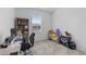 Bedroom features a large window, desk, chair and bookcase at 8550 Cheraw St, Littleton, CO 80125