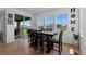 Sunlit dining area with large sliding glass doors and modern furnishings at 8550 Cheraw St, Littleton, CO 80125