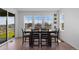 Bright dining area with sliding glass doors, large windows, and an outside view at 8550 Cheraw St, Littleton, CO 80125