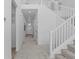 Bright hallway featuring a staircase and ample natural light at 8550 Cheraw St, Littleton, CO 80125