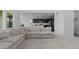 Open-concept living space showcases comfortable seating and easy access to the kitchen at 8550 Cheraw St, Littleton, CO 80125