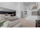 Spacious living area with an open floor plan, adjacent to modern kitchen and staircase at 8550 Cheraw St, Littleton, CO 80125