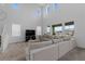 Spacious living room boasts soaring ceilings and large windows, flooding the space with natural light at 8550 Cheraw St, Littleton, CO 80125