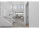 Bright, spacious living room with high ceilings, large windows, and staircase at 8550 Cheraw St, Littleton, CO 80125