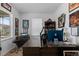 Functional home office with a large desk and natural light at 8550 Cheraw St, Littleton, CO 80125