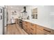 Updated kitchen boasts modern cabinetry, quartz countertops, and stainless steel appliances at 2649 Utica St, Denver, CO 80212