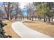 Curved concrete pathway winds through a park at 2649 Utica St, Denver, CO 80212