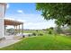 Expansive backyard featuring a covered patio with stunning views of the open green space beyond at 11821 Joplin Ct, Commerce City, CO 80022