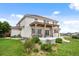 Spacious backyard featuring an outdoor patio with pergola and well-maintained lawn at 11821 Joplin Ct, Commerce City, CO 80022