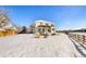 Large backyard with snow-covered ground and wooden fence at 11821 Joplin Ct, Commerce City, CO 80022